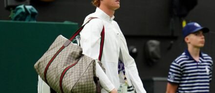 Jannik Sinner carrying Gucci duffel