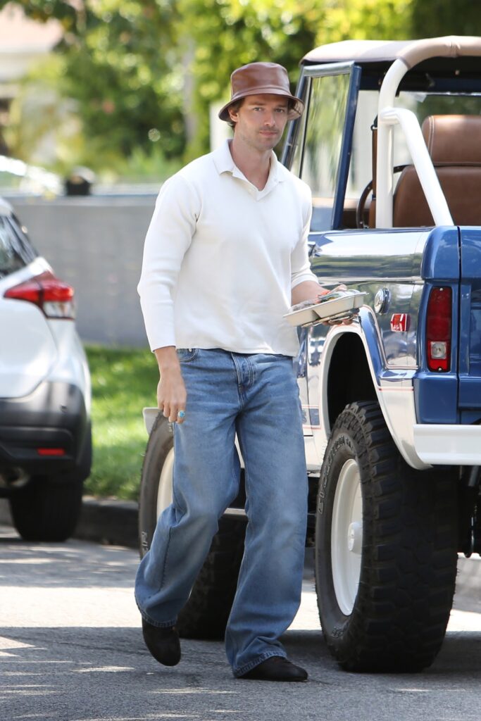 Patrick Schwarzenegger wearing jeans