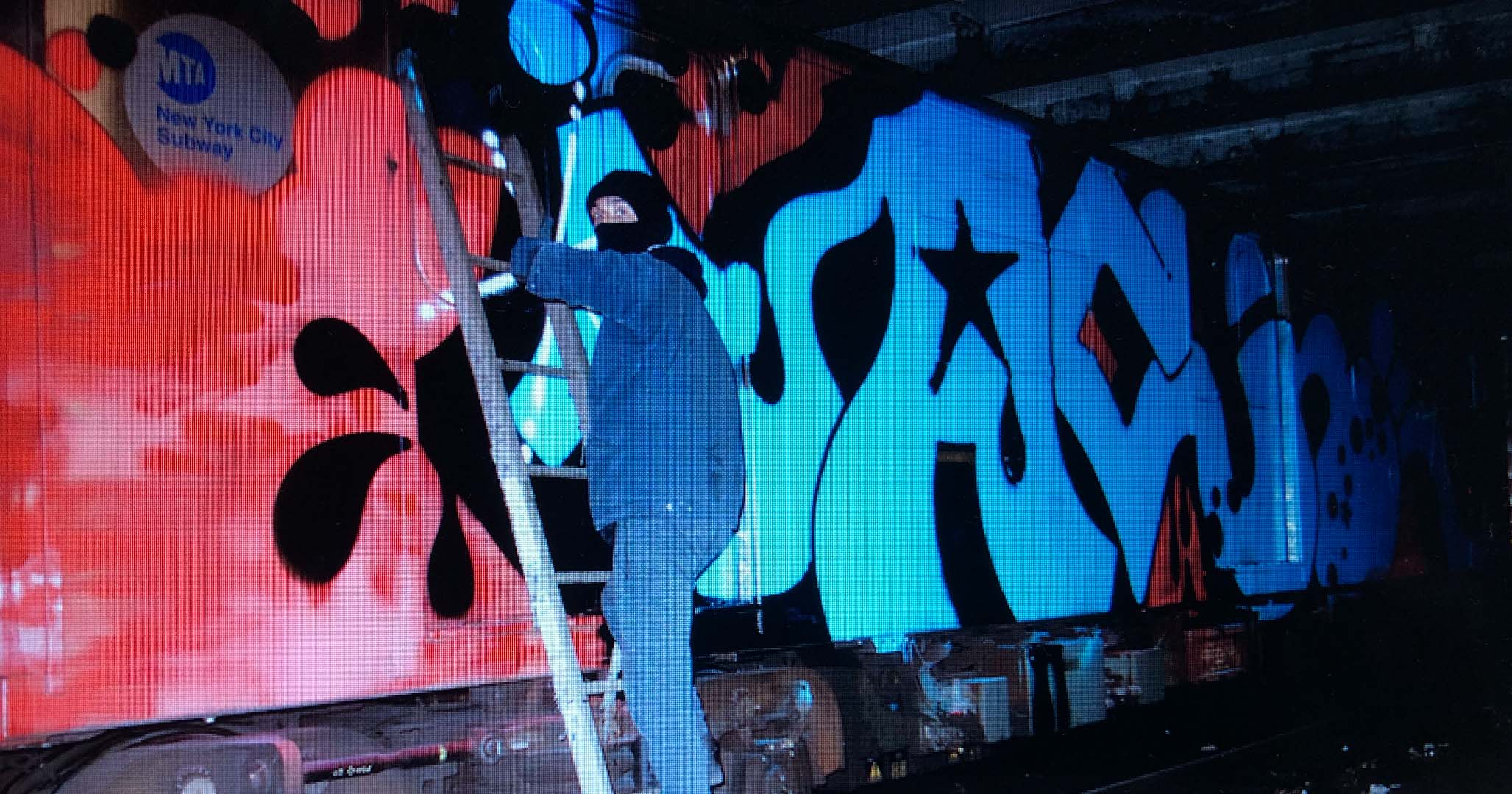 Graffiti artist Renks paints inside the New York subway